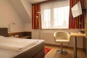 Łóżko lub łóżka w pokoju w obiekcie Hotel Anker