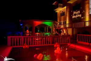 a nightclub with red and green lights at night at Retreat Guest House in Falmouth