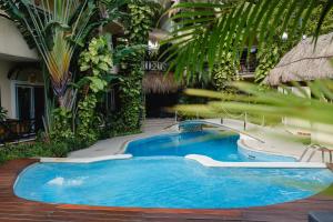 a swimming pool in the middle of a building at Hotel Riviera Del Sol in Playa del Carmen