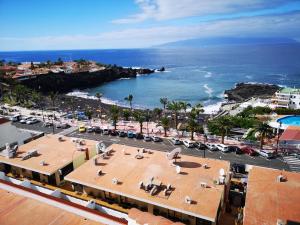 an aerial view of a city and the ocean at Seguro Spacious apartment with roomy terrace, newly renovated in Puerto de Santiago