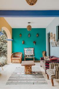 a living room filled with furniture and a fire place at Azul Cielo Hostel in Oaxaca City