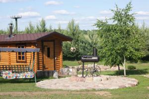 a log cabin with a sign in front of it at Traku Horizontai in Trakai