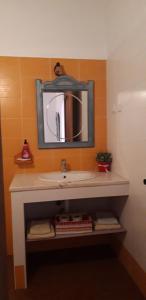 a bathroom with a sink and a mirror at casa da Aldeia in Mina de São Domingos +44 photos