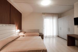 Un pat sau paturi într-o cameră la Residence Elisabetta