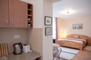 Posteľ alebo postele v izbe v ubytovaní Deluxe Apartments