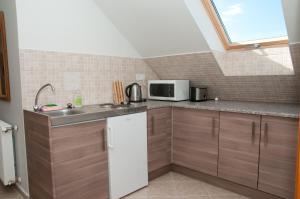 Kuchyňa alebo kuchynka v ubytovaní Deluxe Apartments