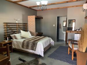 Ένα ή περισσότερα κρεβάτια σε δωμάτιο στο Country Lodge