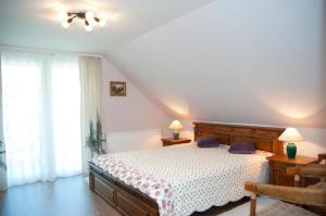 Posteľ alebo postele v izbe v ubytovaní Deluxe Apartments