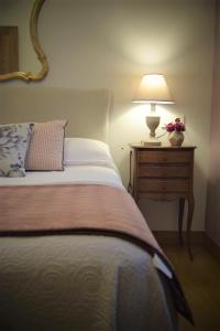 a bedroom with a bed and a lamp on a night stand at Anikuenea in Zaláin