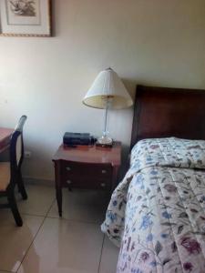 Postel nebo postele na pokoji v ubytování International Hotel, Yaoundé