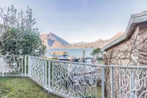 a balcony with a view of a body of water at Varenna Garden in Varenna