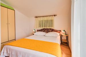 Postel nebo postele na pokoji v ubytování Apartments Kronja
