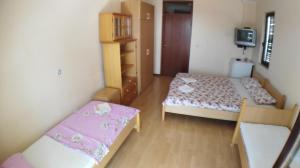 Lova arba lovos apgyvendinimo įstaigoje Guesthouse Obala