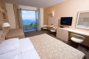 Postel nebo postele na pokoji v ubytování Hotel Mirta - San Simon Resort + 33 fotografií
