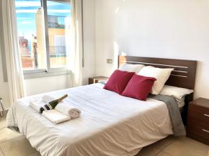 Posteľ alebo postele v izbe v ubytovaní Apartament Familiar Av. Tarragona