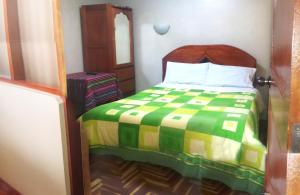 Katil atau katil-katil dalam bilik di Hostal Lucerito