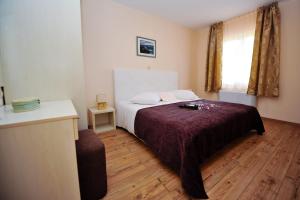 Кровать или кровати в номере Lastura Aparthotel