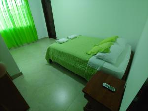 Voodi või voodid majutusasutuse Hostal Punta Arena toas