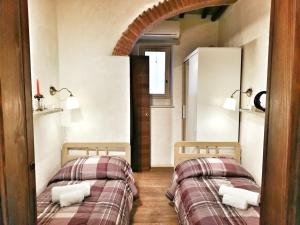 A bed or beds in a room at Appartamento Luna 36 in centro a Firenze