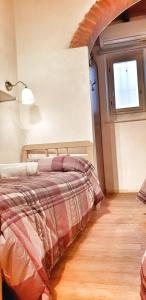 A bed or beds in a room at Appartamento Luna 36 in centro a Firenze