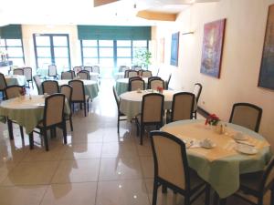 a dining room with tables and chairs in it at Eurohotel in Blankenberge