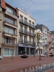 
a city street with a large building at Eurohotel in Blankenberge
