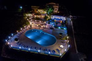 an overhead view of a swimming pool at night at Pansion Villa Antonio in Orebić
