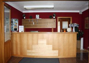 a restaurant with a counter in a room at Chiemgau Appartements in Inzell