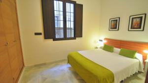 Katil atau katil-katil dalam bilik di Living-Sevilla Apartments San Lorenzo
