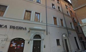 a building with a sign on the side of it at Monte Giordano Flats in Rome