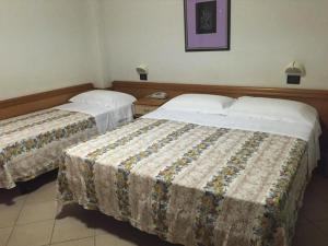 Postel nebo postele na pokoji v ubytování Altamarea Residence & Family Hotel