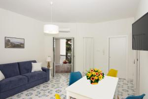 A television and/or entertainment centre at Ambra Sorrento Suites Short Rent