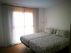 Postel nebo postele na pokoji v ubytování Tenerife House Playa de las Américas