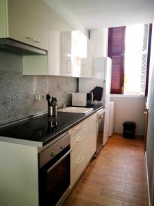 Kuchyň nebo kuchyňský kout v ubytování Tenerife House Playa de las Américas