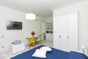 A kitchen or kitchenette at Ambra Sorrento Suites Short Rent