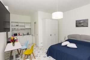 A bed or beds in a room at Ambra Sorrento Suites Short Rent