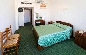 Postel nebo postele na pokoji v ubytování Marion Hotel + 7 fotografií