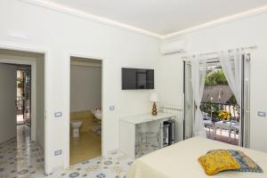 A television and/or entertainment centre at Ambra Sorrento Suites Short Rent