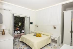A bed or beds in a room at Ambra Sorrento Suites Short Rent