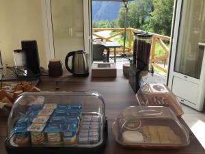 a table with containers of drinks and food on it at Ô cœur de l’île in Salazie