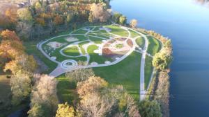 an aerial view of a park on a hill next to the water at Willa Wanda - duży ogród z hot-tube i sauna in Sztum