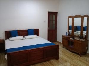 Postel nebo postele na pokoji v ubytování Kuma Beach side Villa + 37 fotografií