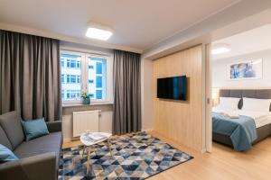 Ένα ή περισσότερα κρεβάτια σε δωμάτιο στο Q17 Apartments Rynek