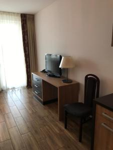 Televízia a/alebo spoločenská miestnosť v ubytovaní Apartament 454 w hotelu Diva
