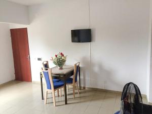 A television and/or entertainment centre at Hotel Marie Antoinette Lome