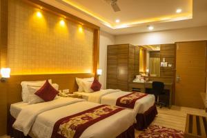 Voodi või voodid majutusasutuse Hotel Harrison Palace toas