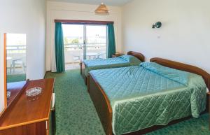 Postel nebo postele na pokoji v ubytování Marion Hotel