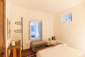 Postel nebo postele na pokoji v ubytování Casa di Charme, Rio nell'Elba