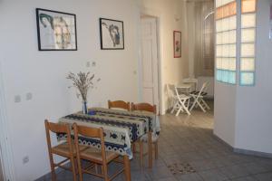 a dining room with a table and chairs at Green Market Apartment in Opatija