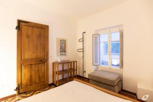 Postel nebo postele na pokoji v ubytování Casa di Charme, Rio nell'Elba